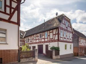 an old house with a brown and white building at Wohnung in Battenberg nahe Winterberg Skigebiet in Battenberg