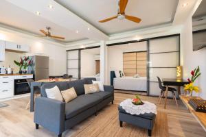 a living room with a couch and a bedroom at TERA ORA TORU - Lodge and sea view in Papeete +69 photos