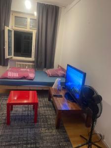 a room with a laptop computer on a table at Mano 31 in Stuttgart