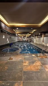 a large swimming pool in a building at Al-Amaari Gardens Compound 3092 in Irbid
