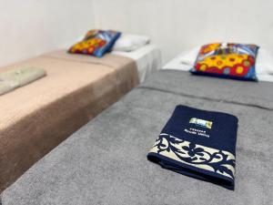 En eller flere senge i et værelse på Pousada Açude Velho II