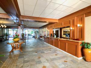 a lobby of a hotel with a counter and a table at Lahaina Shores Oceanfront Studio in Lahaina