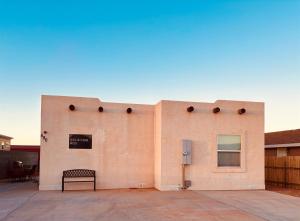 a building with a bench on the side of it at ️Full Kitchen11 bedbath in this home at discountnear canyonsBoat Parking in Page +25 photos