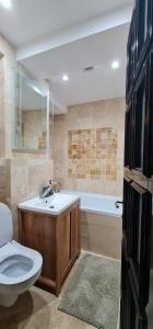 Koupelna v ubytování White Cozy Home + 4 fotografie