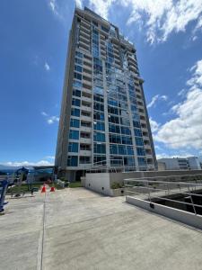 a tall building with a lot of windows at Exclusive apartment in downtown Costa Rica in San José