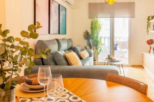 a living room with a couch and a table at Dream Costa Blanca Luxury Apartment in Torrevieja