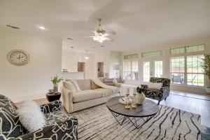 a living room with a couch and a table at Game Room and Bar Secluded Getaway in Farmersville in Nevada
