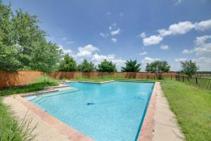 a swimming pool in a yard with a fence at Game Room and Bar Secluded Getaway in Farmersville in Nevada