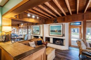 a living room with a couch and a fireplace at NorthShore # 47 By Hauserman Rentals in Tahoe City