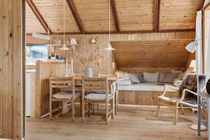a dining room with a table and chairs and a bed at 1024-Thisted-Lars-Badskjaers-Sti-2 in Torsted +15 photos