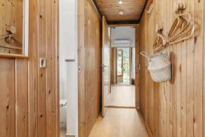 a hallway with wood paneled walls and a purse at 1024-Thisted-Lars-Badskjaers-Sti-2 in Torsted