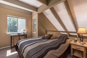 a bedroom with a large bed and a window at Dollar Hill II # 49 By Hauserman Rentals in Tahoe City +15 photos