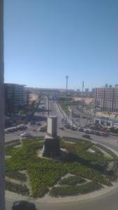a view of a street with a monument in a city at شاليه بجولف بورتو مارينا للأسر فقط in El Alamein