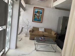 a living room with a couch and a table at Casa sola con alberca y vista al lago in Cedro