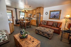 a living room with a couch and a table at Franciscan Lakeside # 29 By Hauserman Rentals in Tahoe Vista