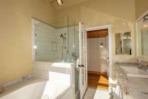 a bathroom with a shower and a sink at Snowglobe By Hauserman Rentals in Tahoe City