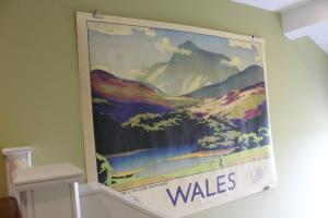 a large painting hanging on a wall at The Tilman in Barmouth