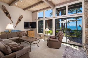 a living room with a couch and chairs and a television at Star Harbor # 6 By Hauserman Rentals in Tahoe City