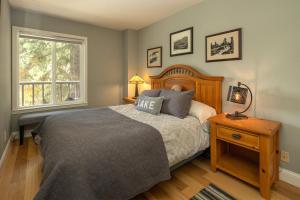 a bedroom with a large bed and a window at Dollar Hill II # 25 By Hauserman Rentals in Tahoe City +28 photos