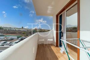 a balcony with a view of a parking lot at Marina Palace duplex in Adeje