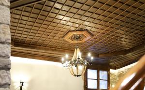 a chandelier hanging from a ceiling in a room at Oda e Gurit - Boutique Hotel in Berat