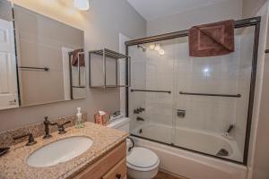 a bathroom with a sink and a shower at Lake Forest Glen # 117 By Hauserman Rentals in Tahoe City +24 photos