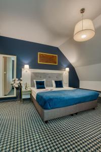 Ένα ή περισσότερα κρεβάτια σε δωμάτιο στο Hotel Villa Art Novis City Center