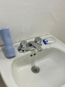 a bathroom sink with a faucet on top of it at Hotel del Pueblo in Teotitlán del Valle +37 photos