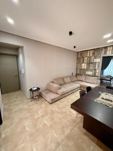 a living room with a couch and a table at Plaza Vista in Kalamata