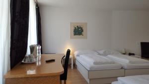 Postel nebo postele na pokoji v ubytování Spalenbrunnen Hotel & Restaurant Basel City Center