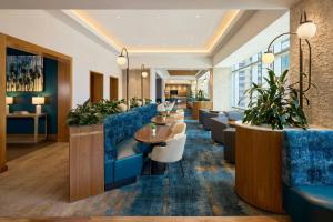a lobby of a hotel with couches and tables at JW Marriott Austin in Austin