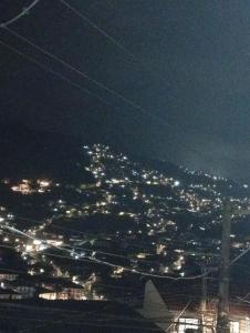 a view of a city lit up at night at Casa aconchegante in Ouro Preto