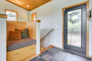 a tiny house with a bench and a window at Modern Summit Lake Escape - Spacious Deck with View! in Kamilche