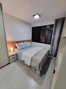 Ένα ή περισσότερα κρεβάτια σε δωμάτιο στο Studios Interlagos 102