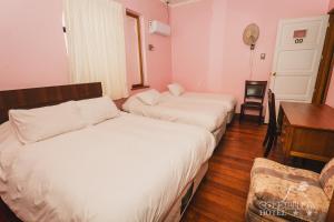 Ένα ή περισσότερα κρεβάτια σε δωμάτιο στο Hotel Cordillera