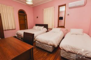 Ένα ή περισσότερα κρεβάτια σε δωμάτιο στο Hotel Cordillera