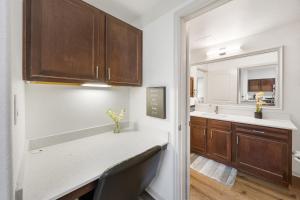 a kitchen with a sink and a counter top at Brightshaven CoolSprings, Modern 1Bed with EV Parking in Frisco in Frisco