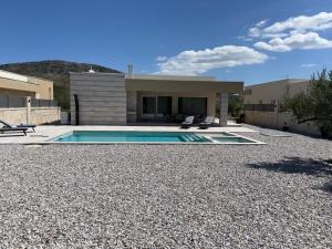 a house with a swimming pool in front of a house at Villa Grabovina in Čapljina