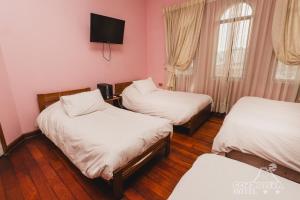 Ένα ή περισσότερα κρεβάτια σε δωμάτιο στο Hotel Cordillera