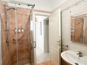 a bathroom with a shower and a sink at Casa Maristé in Favignana