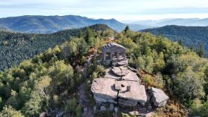 an aerial view of a house on top of a mountain at L'escale du Donon - Chambre Blanche in Grandfontaine