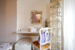 a bathroom with a dressing table and a mirror at Romantic room nel Borgo di Cervo in Cervo