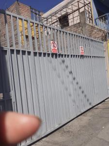 a persons finger is pointing at a white fence at Arequipa- LaPampilla in La Pampilla +14 photos