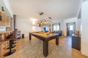 a large room with a ping pong table in it at Sagres ZEN - 3 Bedroom House in Sagres