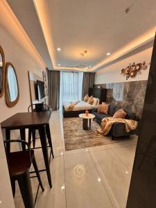 a living room with a couch and a table at Deluxe Kass Studio in Accra +41 photos