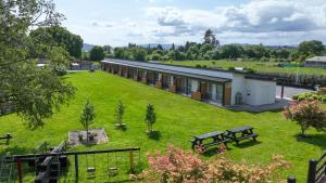 an aerial view of a building with a large yard at Hideaway of Rotorua in Rotorua +91 photos