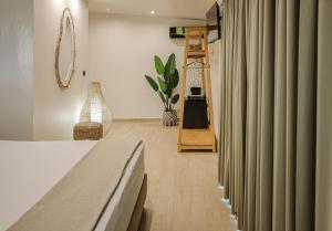 Ένα ή περισσότερα κρεβάτια σε δωμάτιο στο AMMOESSA APARTMENTS