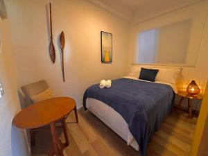 Katil atau katil-katil dalam bilik di Casa de praia com ar condicionado.