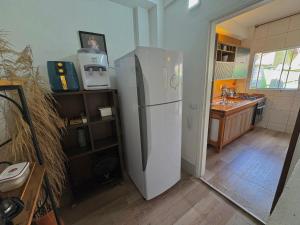Dapur atau dapur kecil di Casa de praia com ar condicionado. +15 gambar