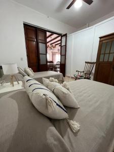 a bedroom with two beds with pillows on them at Casa Rocamora - Victoria Entre Ríos in Victoria